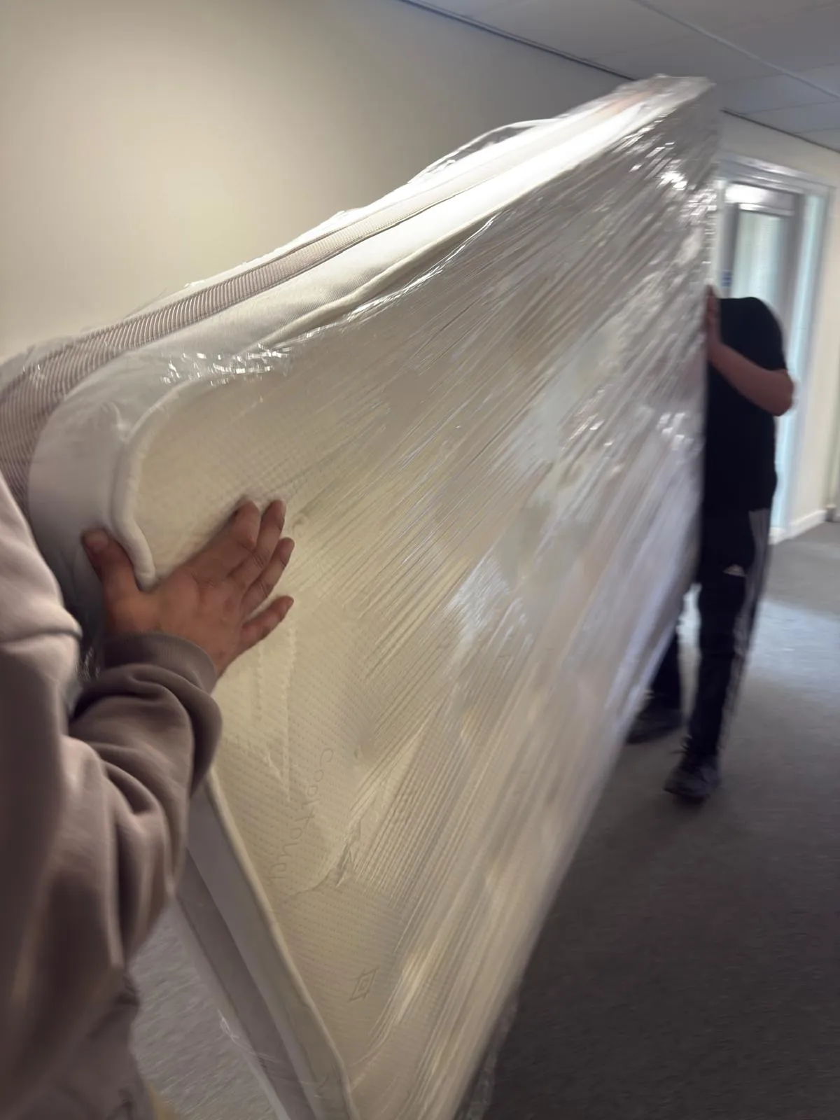 A sofa protected with removals blankets